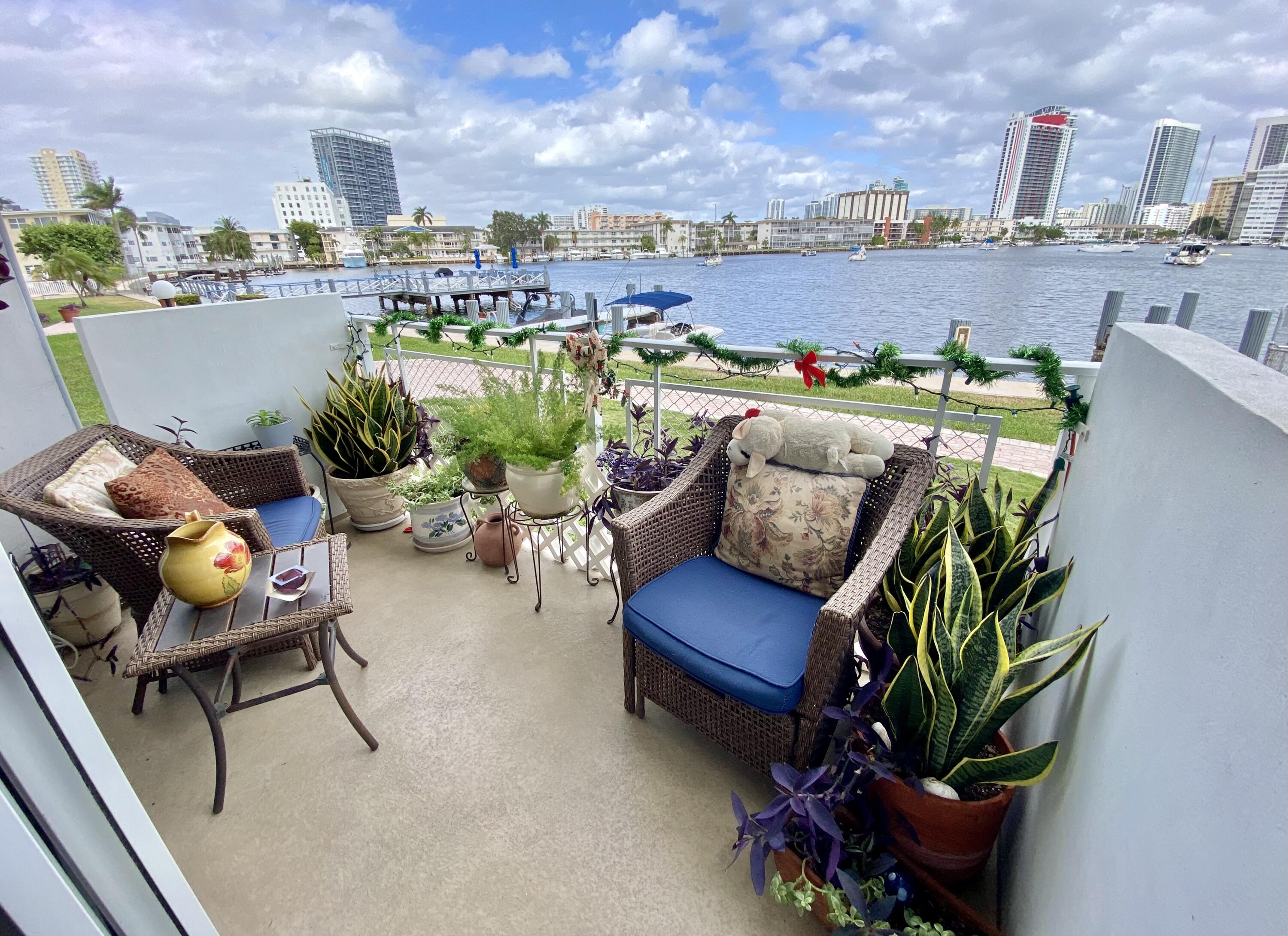 a terrace with outdoor seating and city view