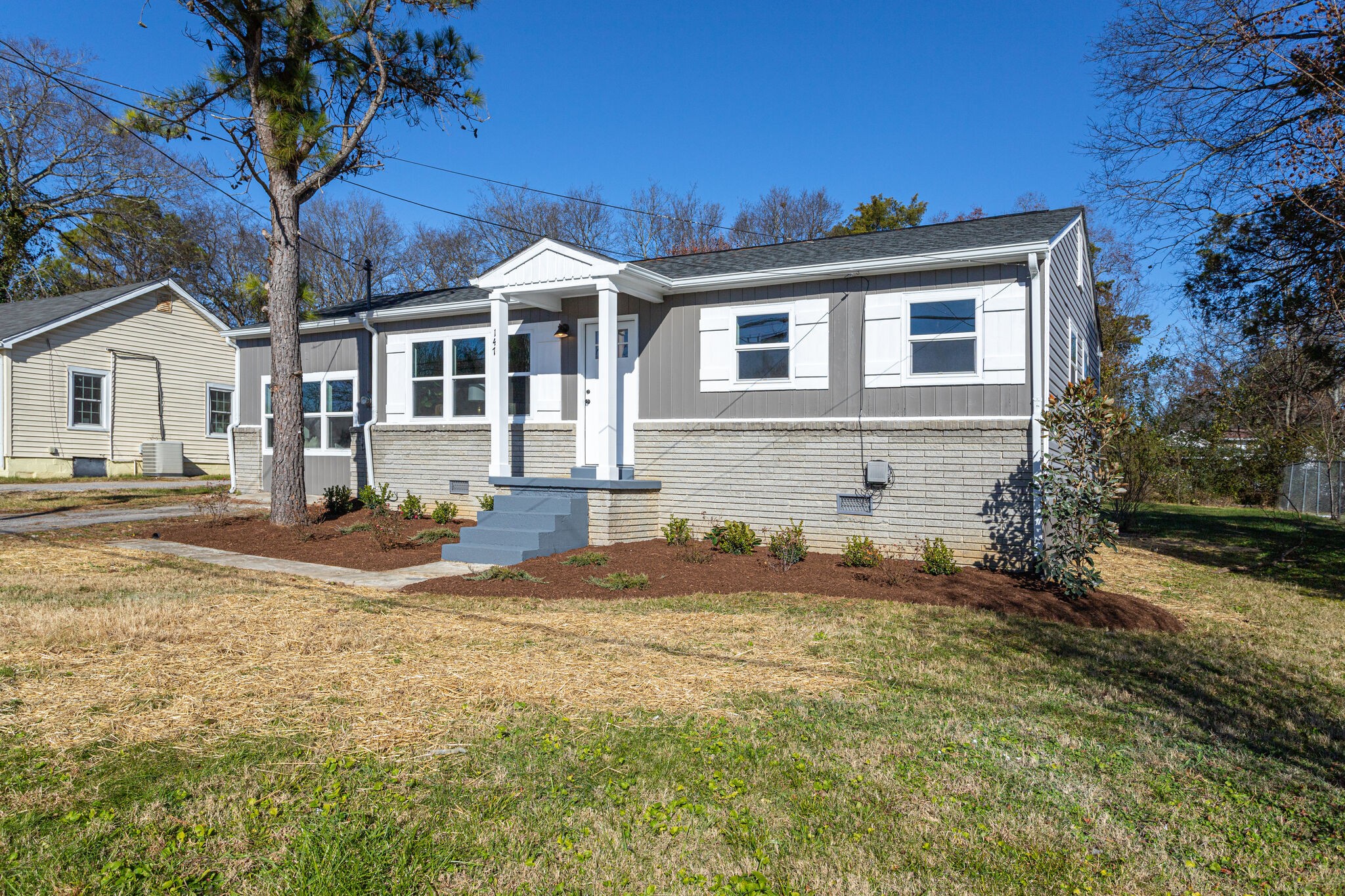 a front view of a house with a yard