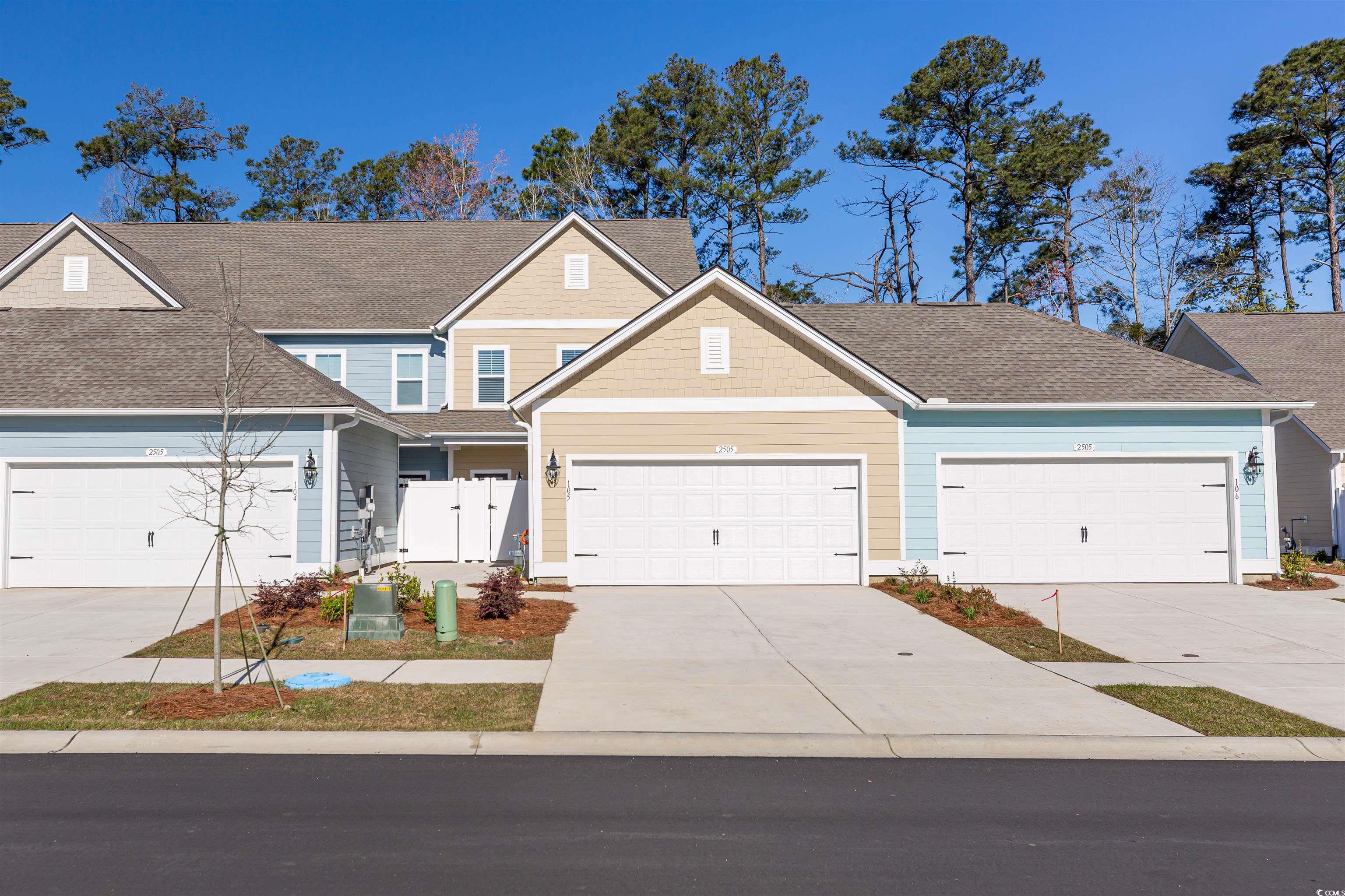 View of front facade featuring a garage