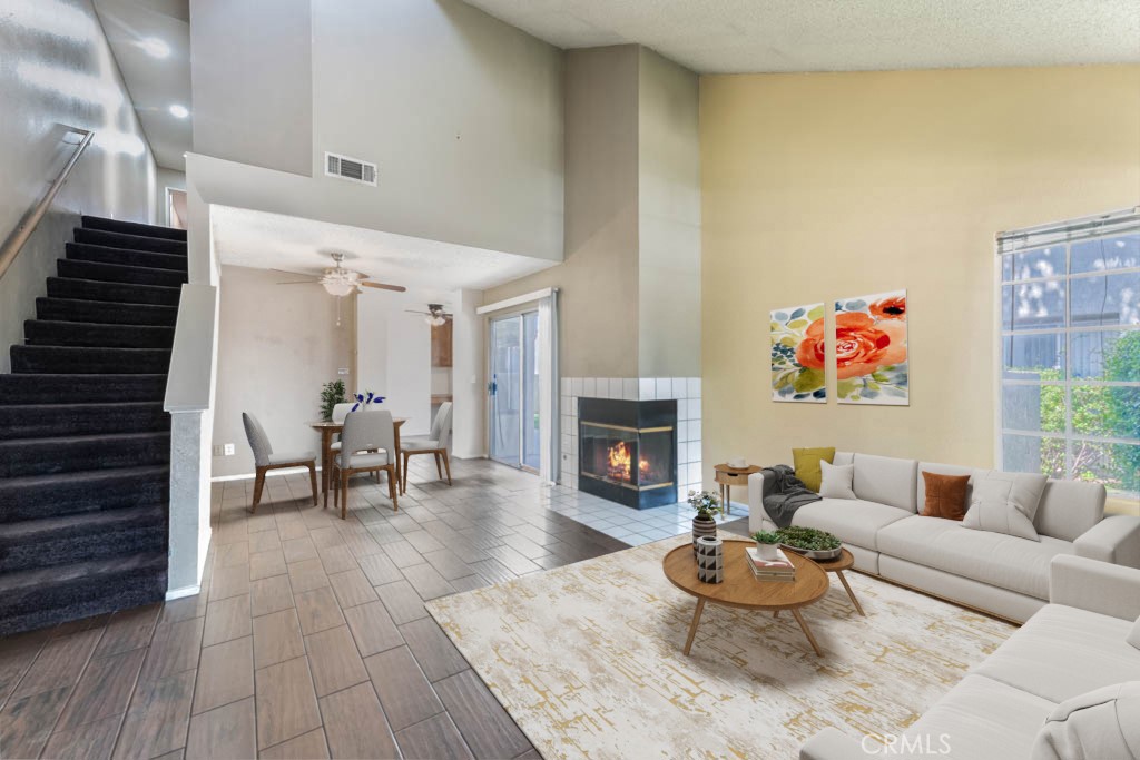 a living room with furniture and a fireplace