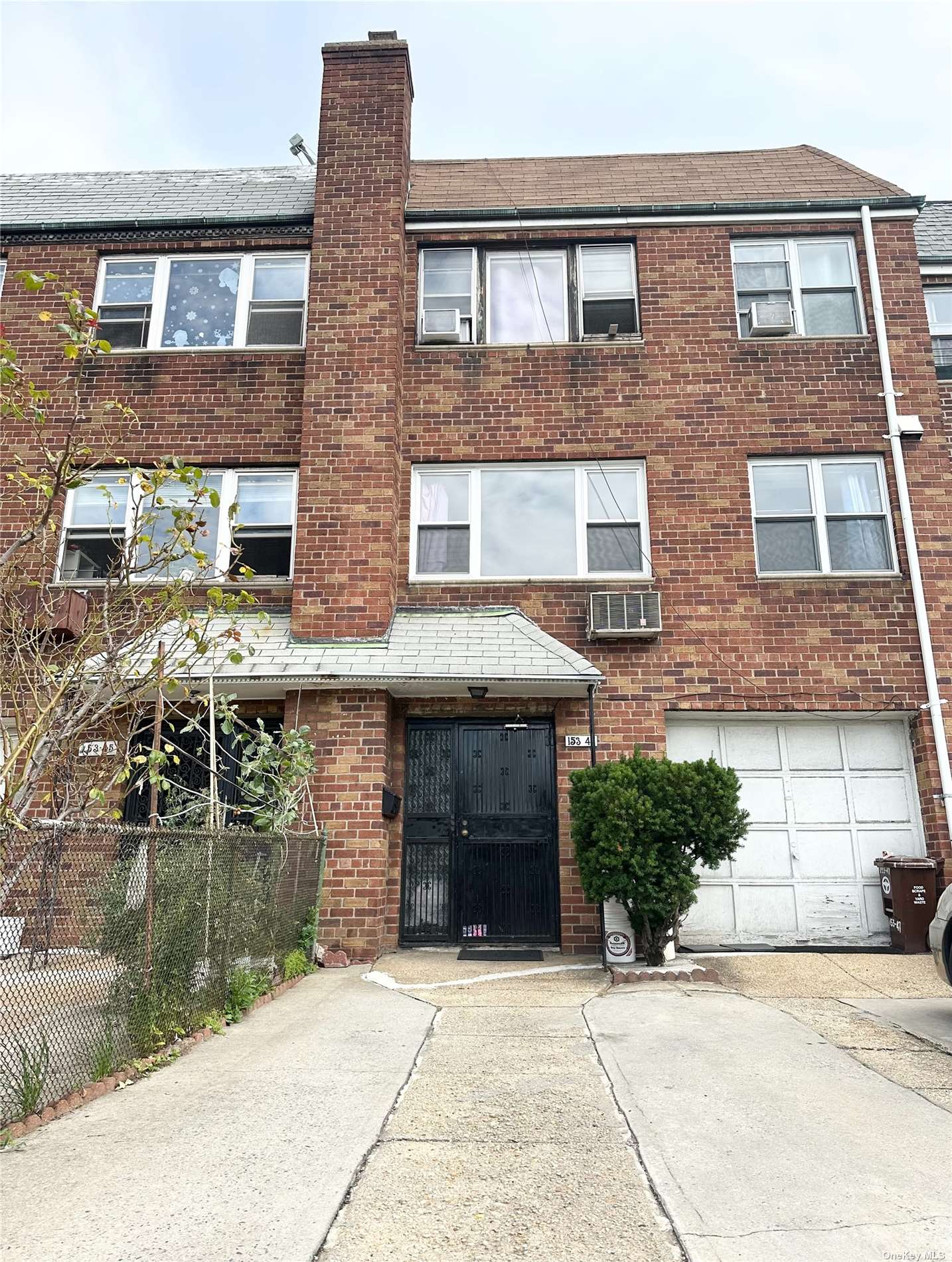 a front view of a house with yard