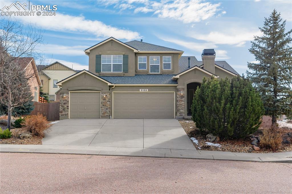 View of front of home featuring a garage