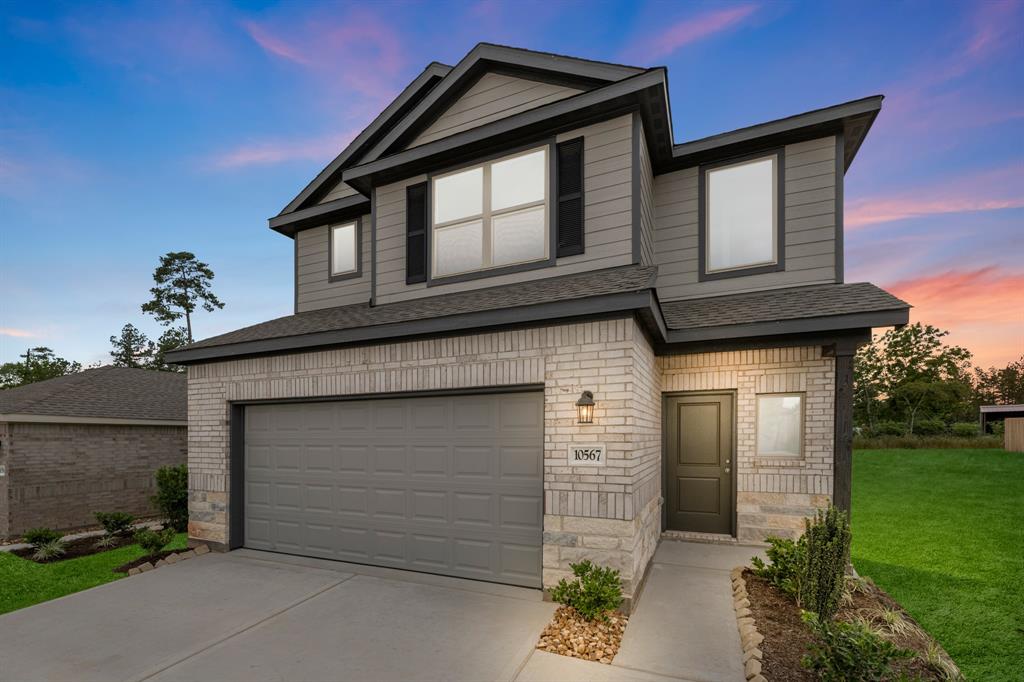 a front view of a house with a garage