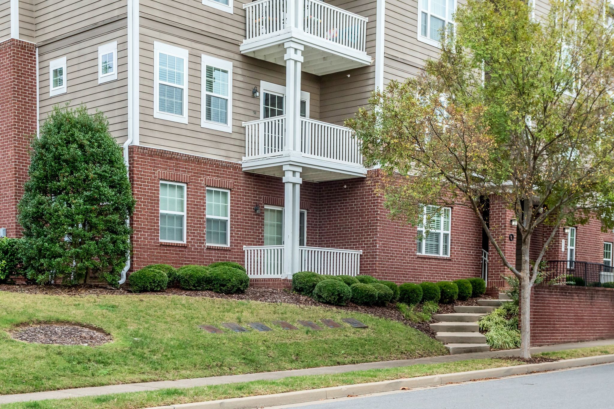 Front of building. Unit is 2nd floor with covered balcony seen here, with access from rear of building at street level.