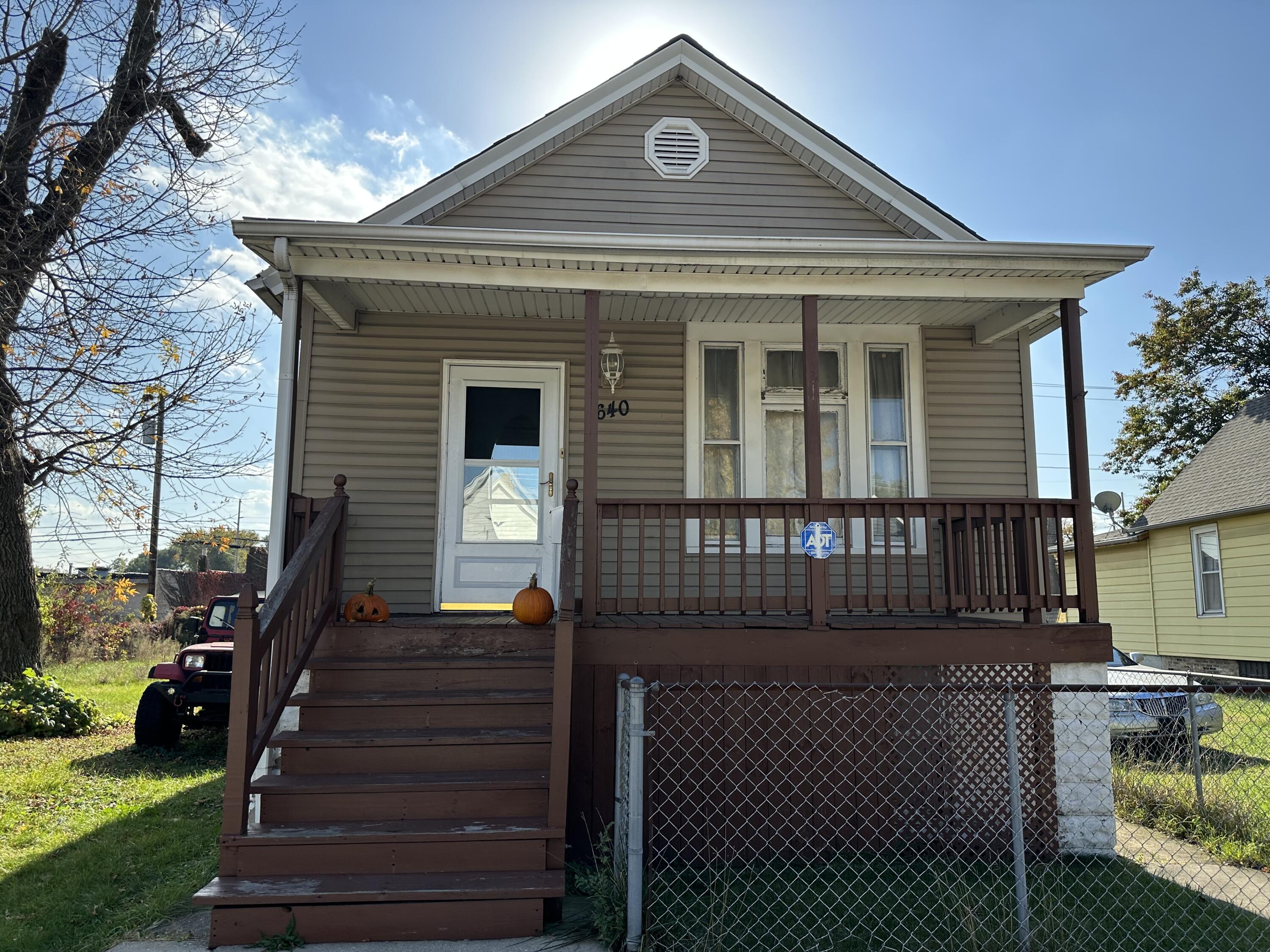 a front view of house with stairs