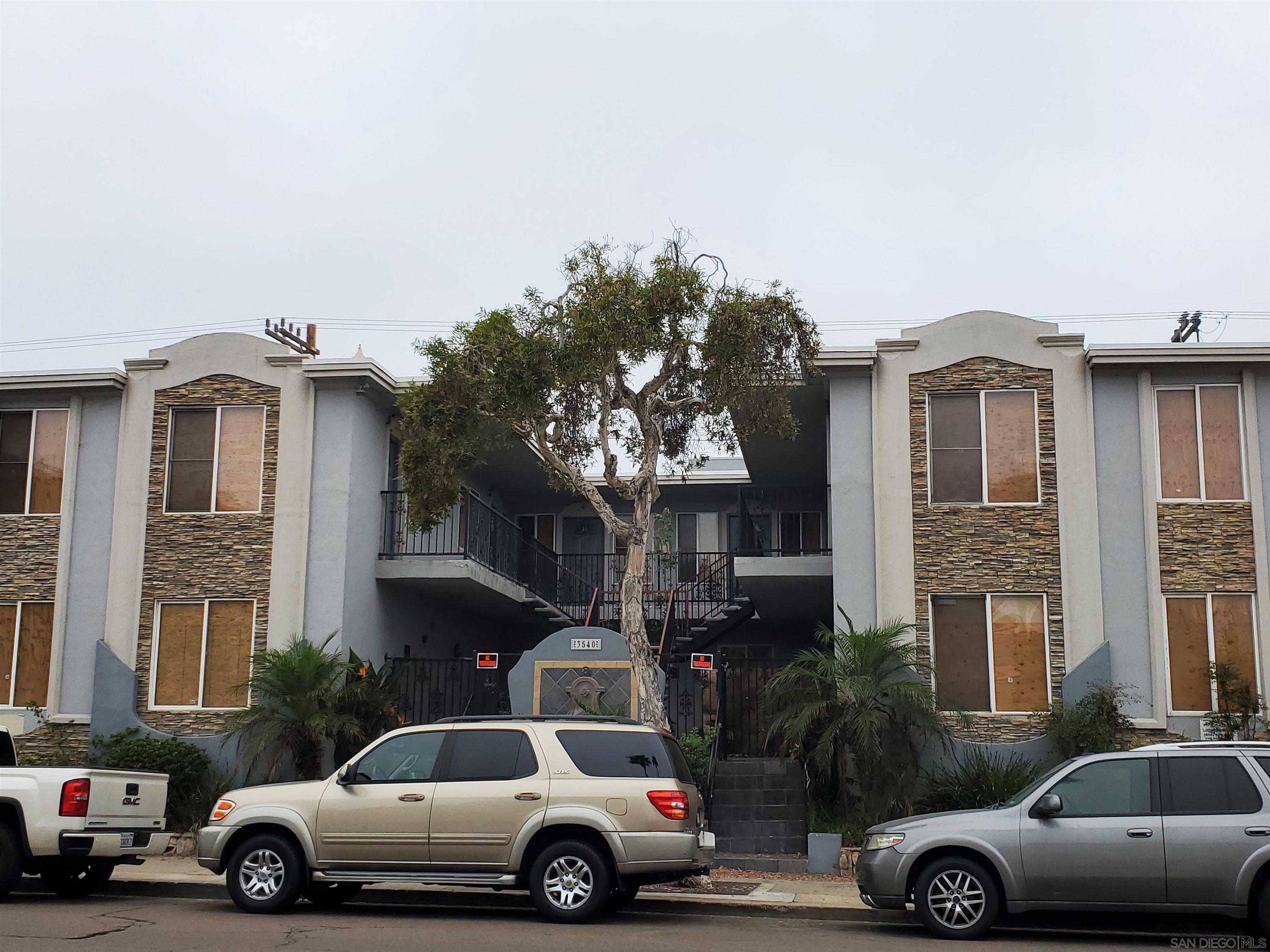 a front view of a house with parking space