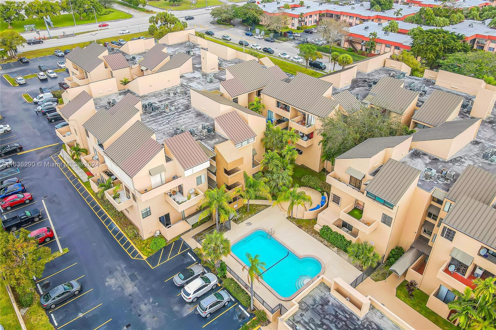 an aerial view of a house with a swimming pool