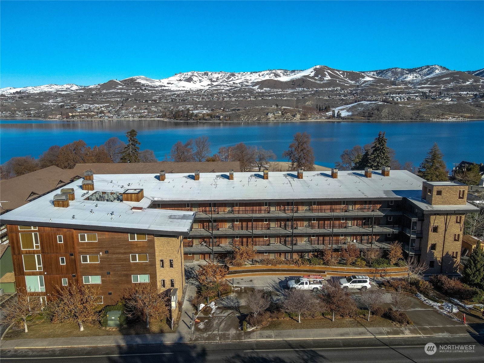 a large building with a mountain in the background