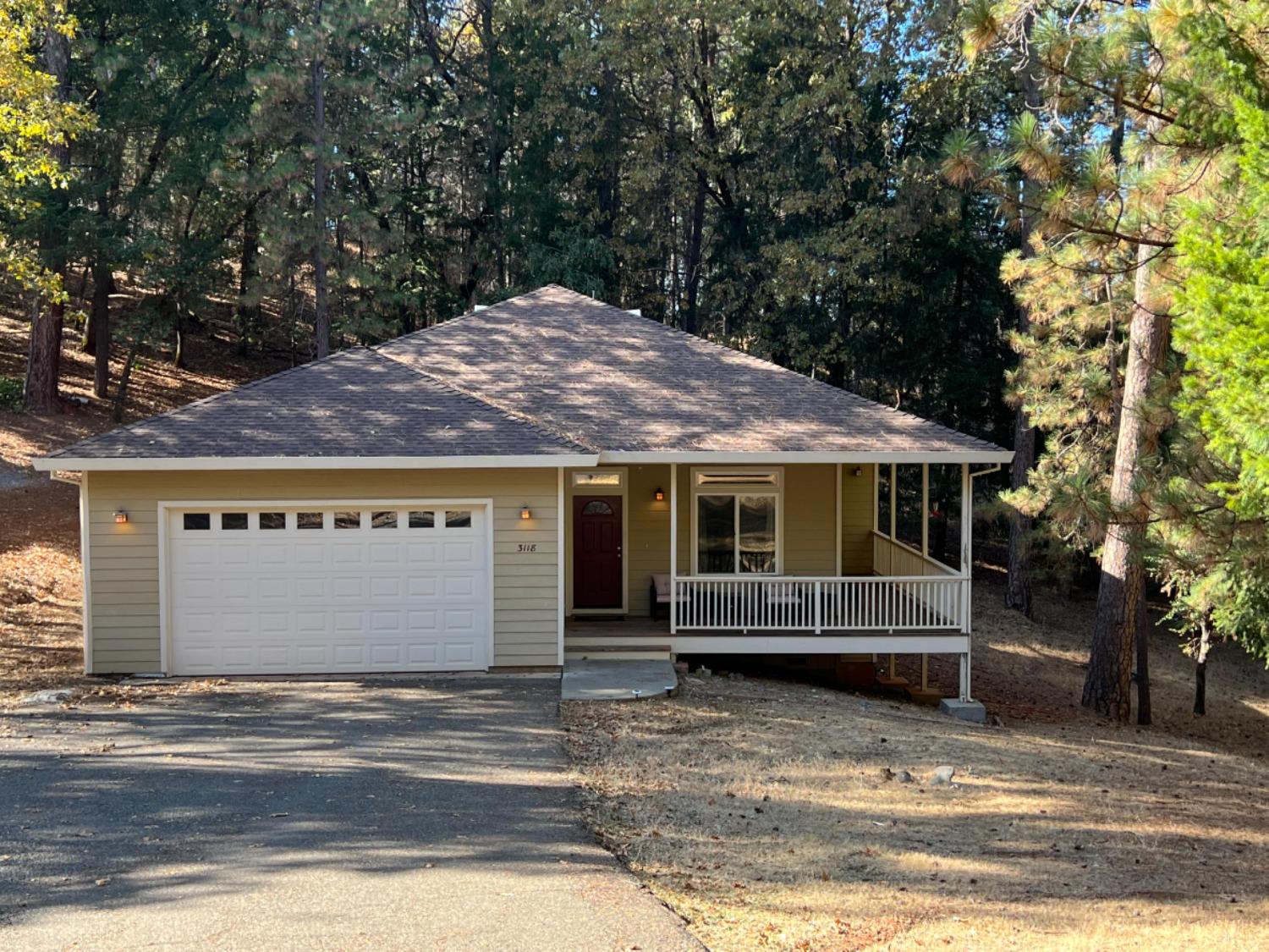 a front view of a house with a yard