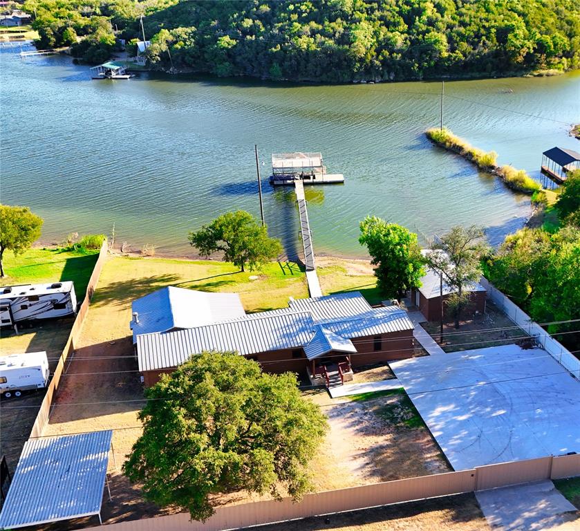 a view of a swimming pool with a yard