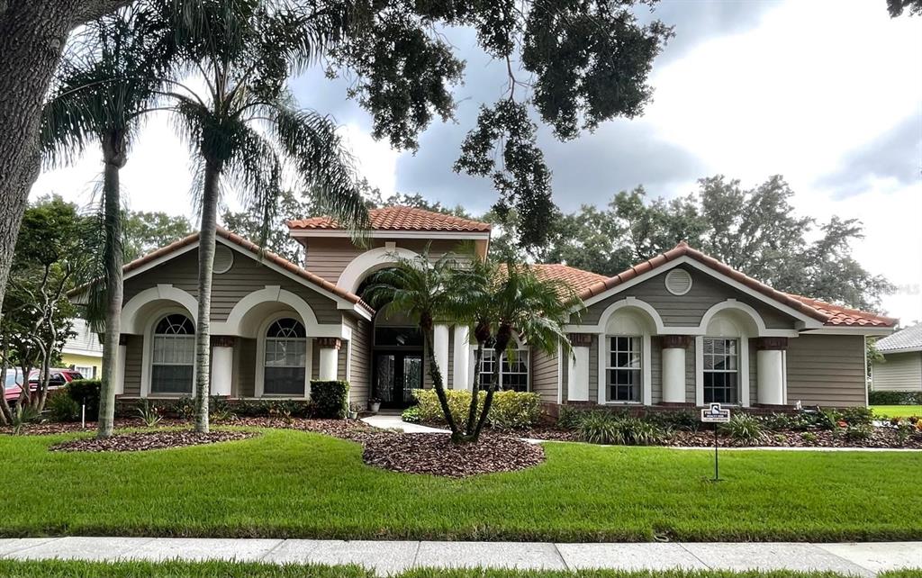 a front view of a house with a yard