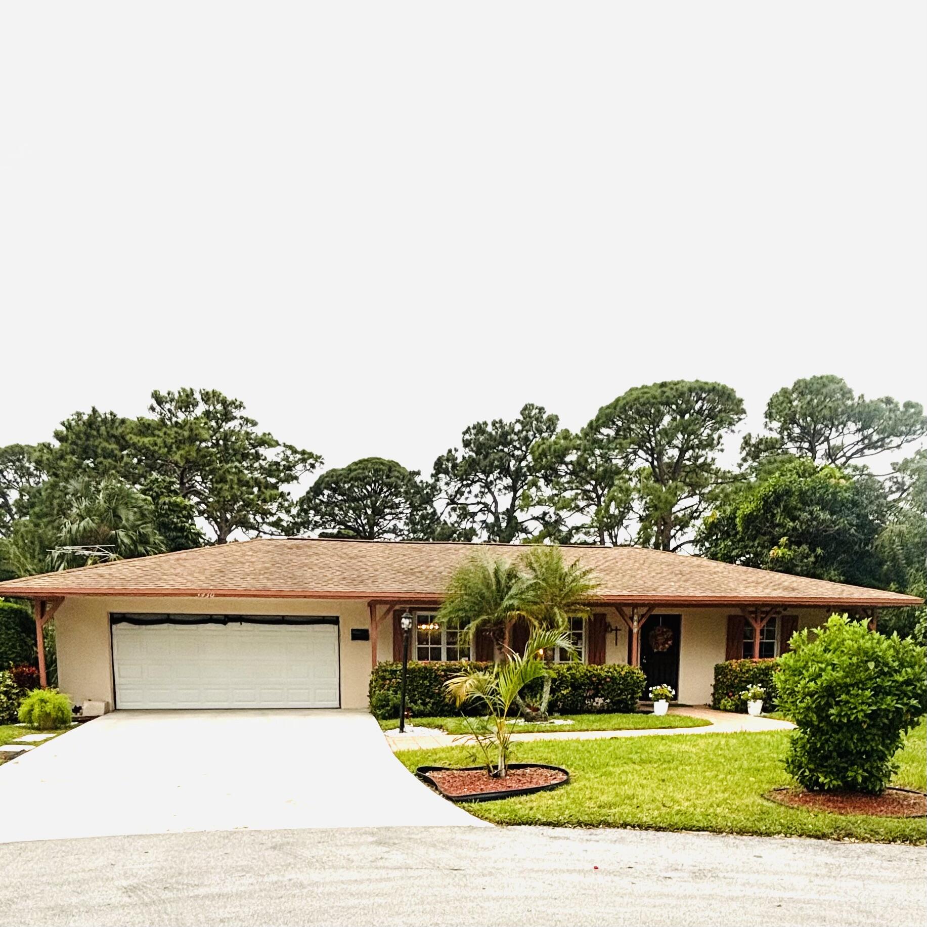 a view of house with yard and play ground