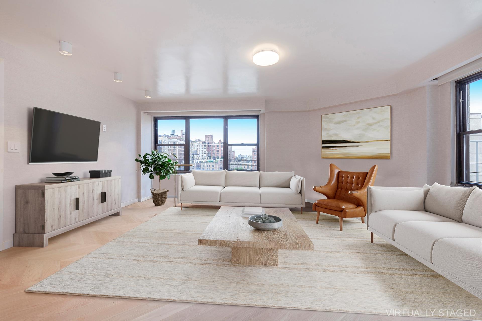 a living room with furniture and a flat screen tv