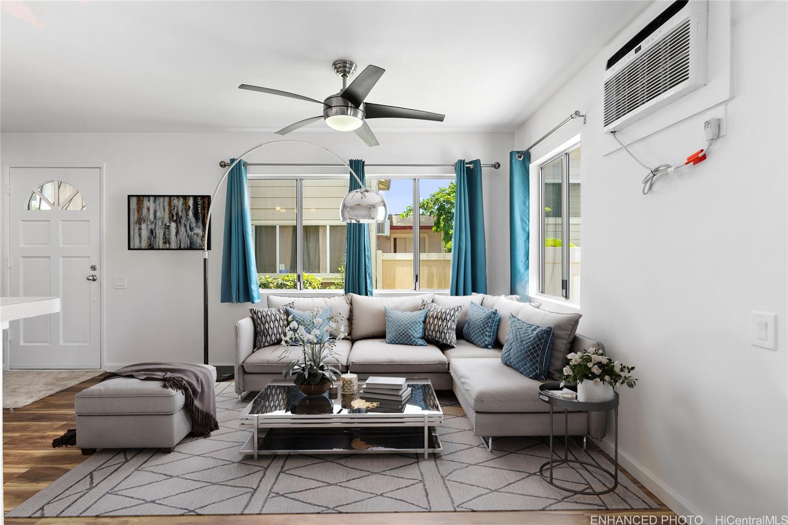 a living room with furniture and a large window