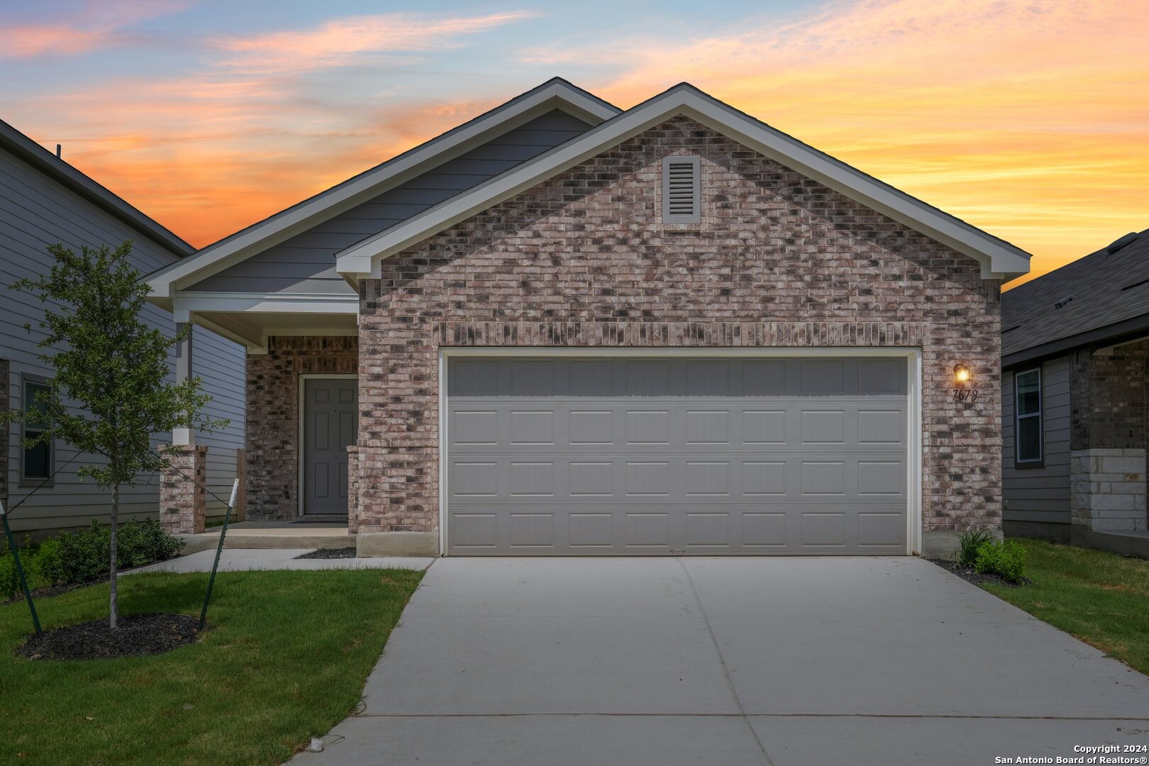 front view of a house with a yard