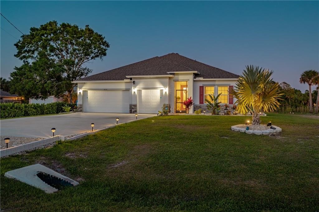 a front view of a house with a yard