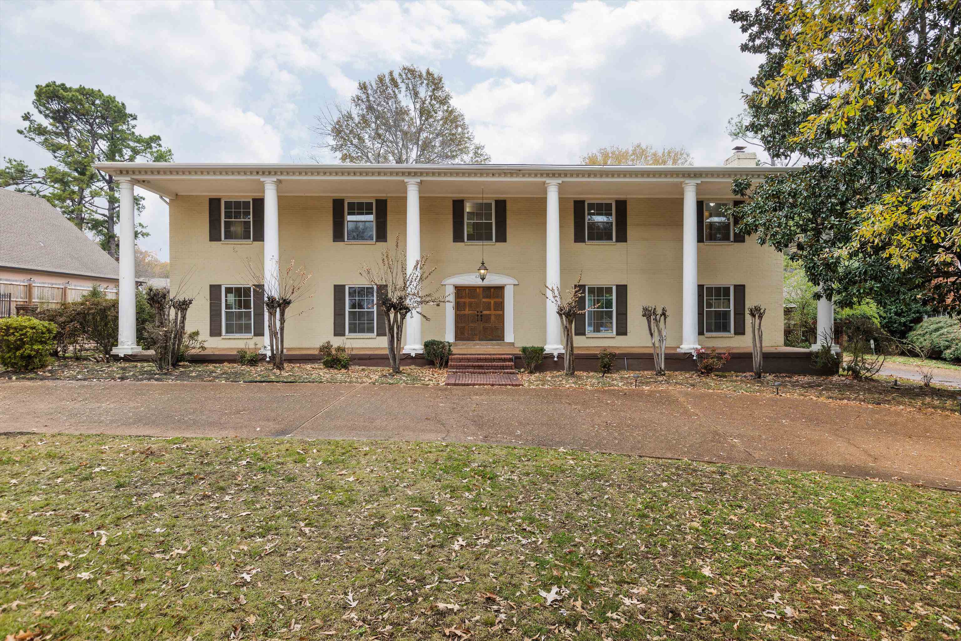 front view of a house with a yard