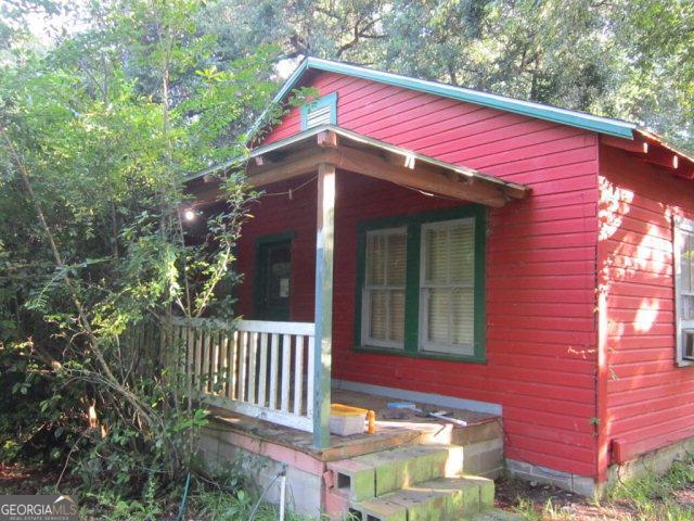 a view of a house with a small yard