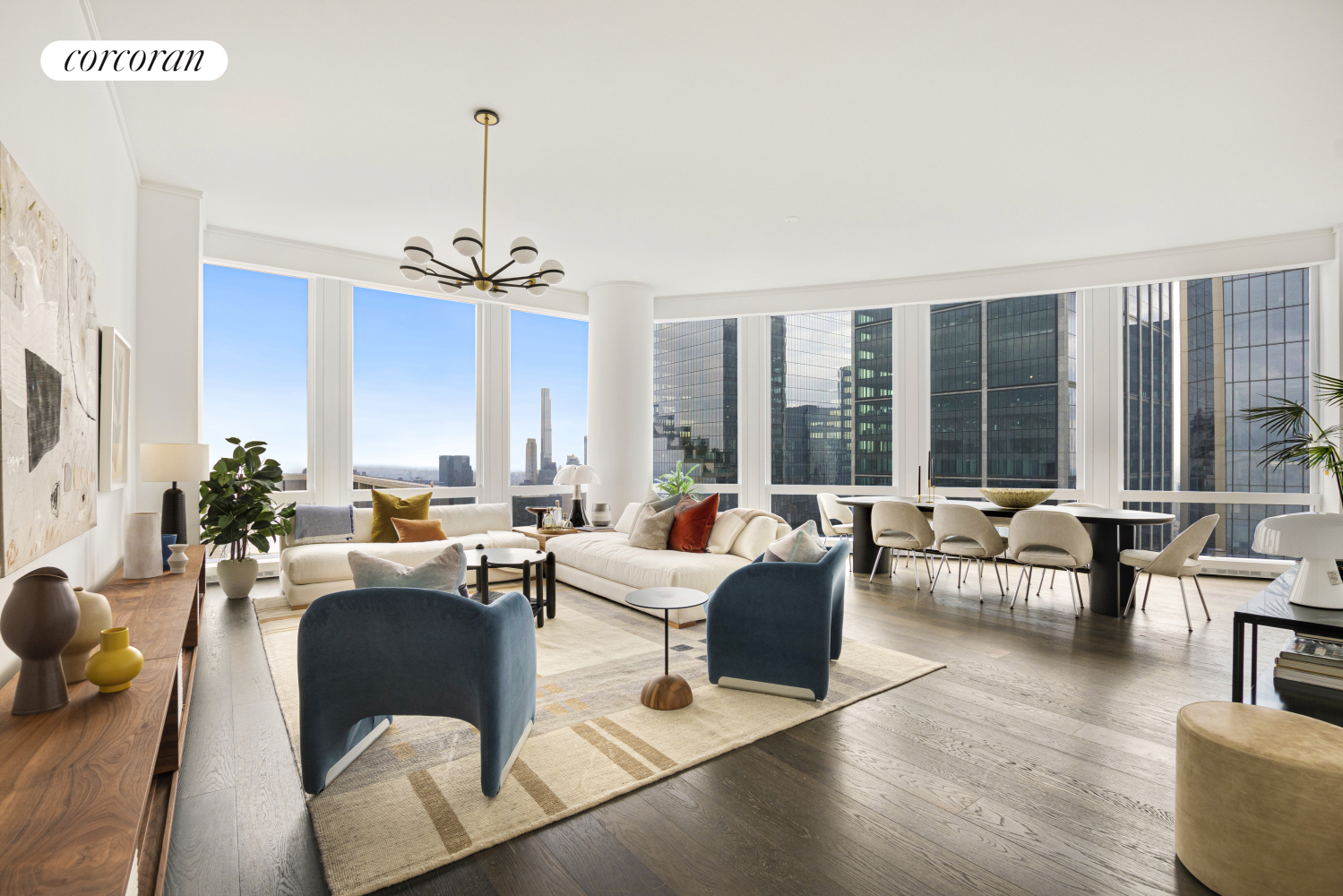 a living room with furniture and floor to ceiling windows