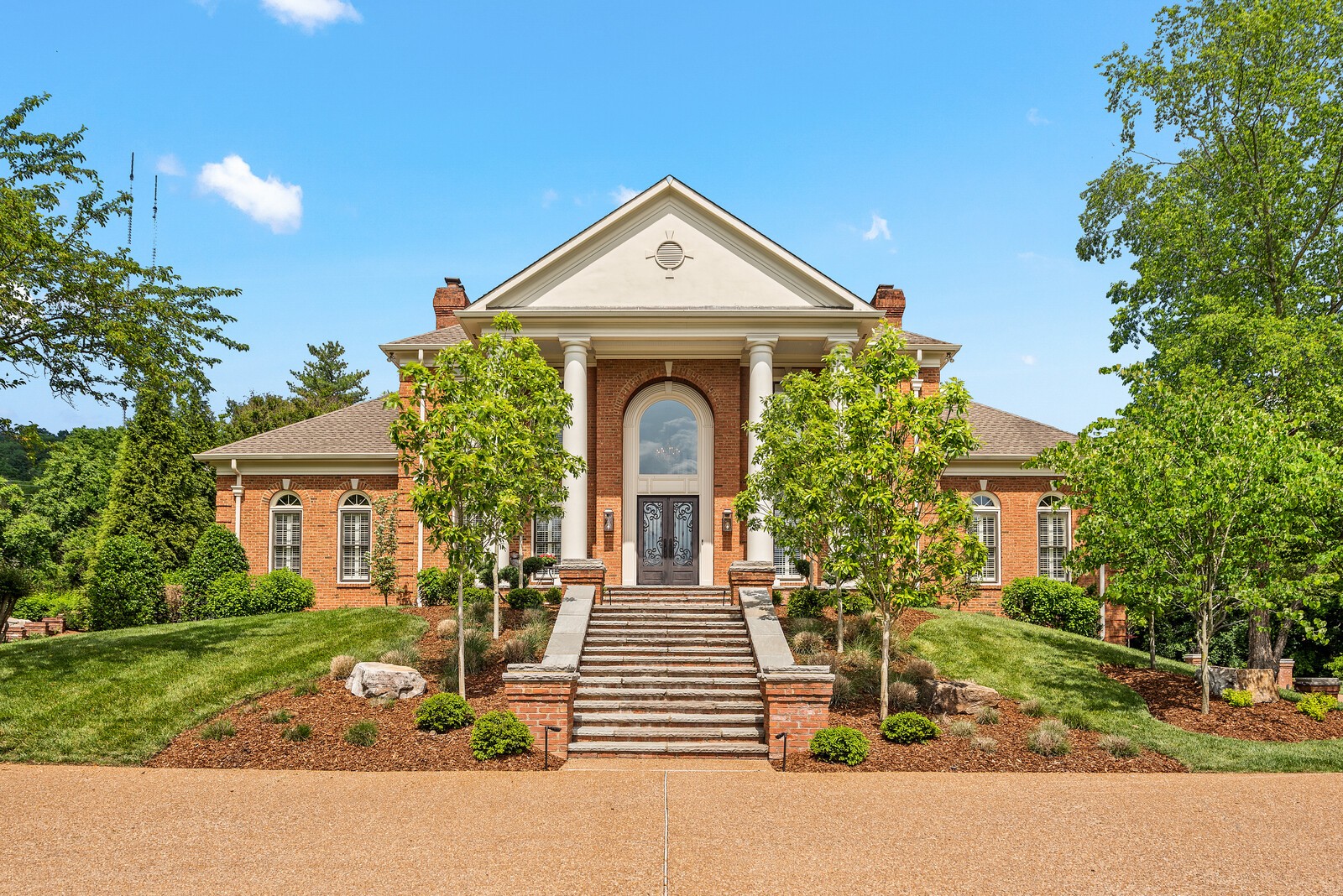 front view of a house with a yard