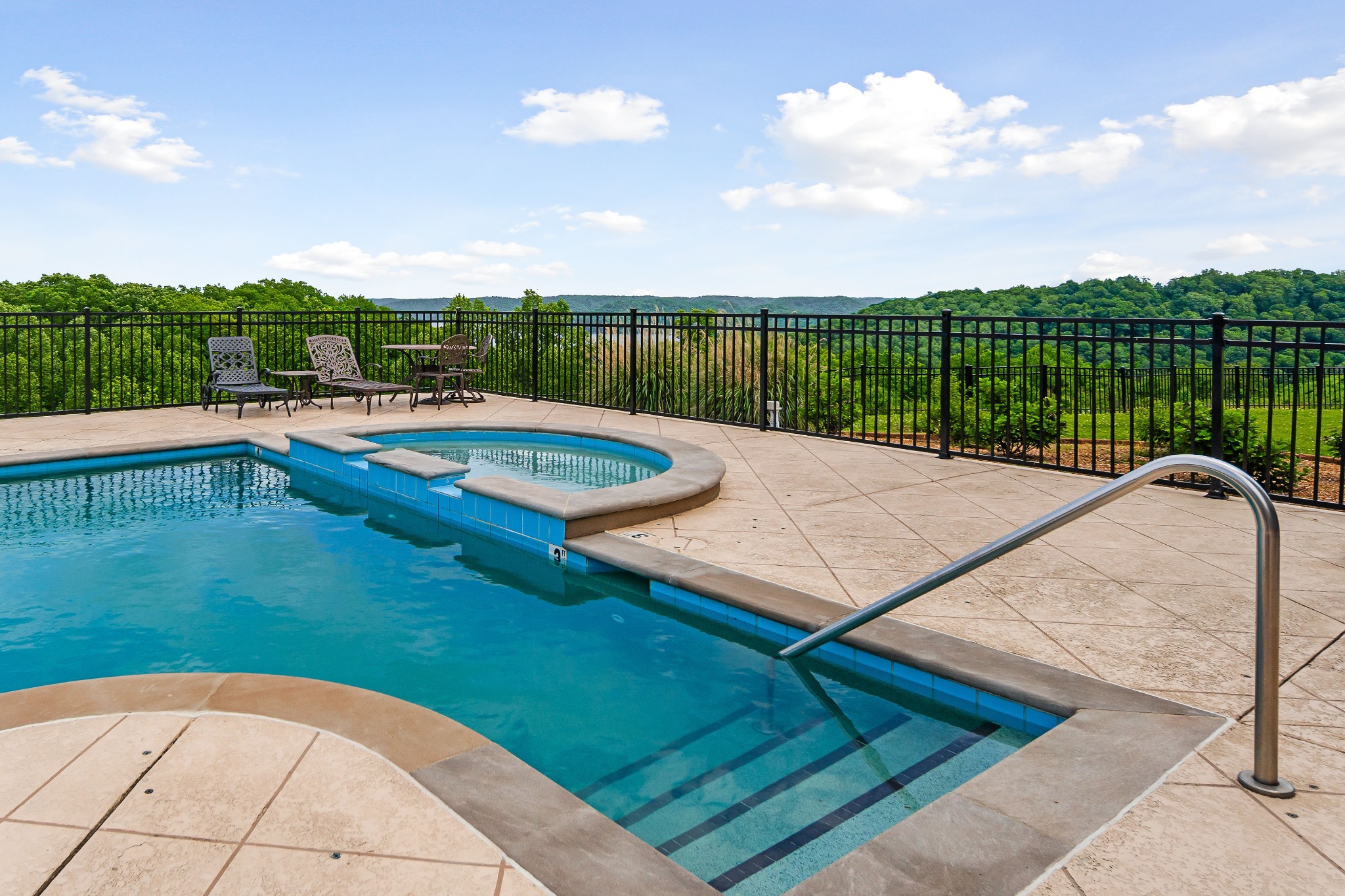 swimming pool view with a garden space