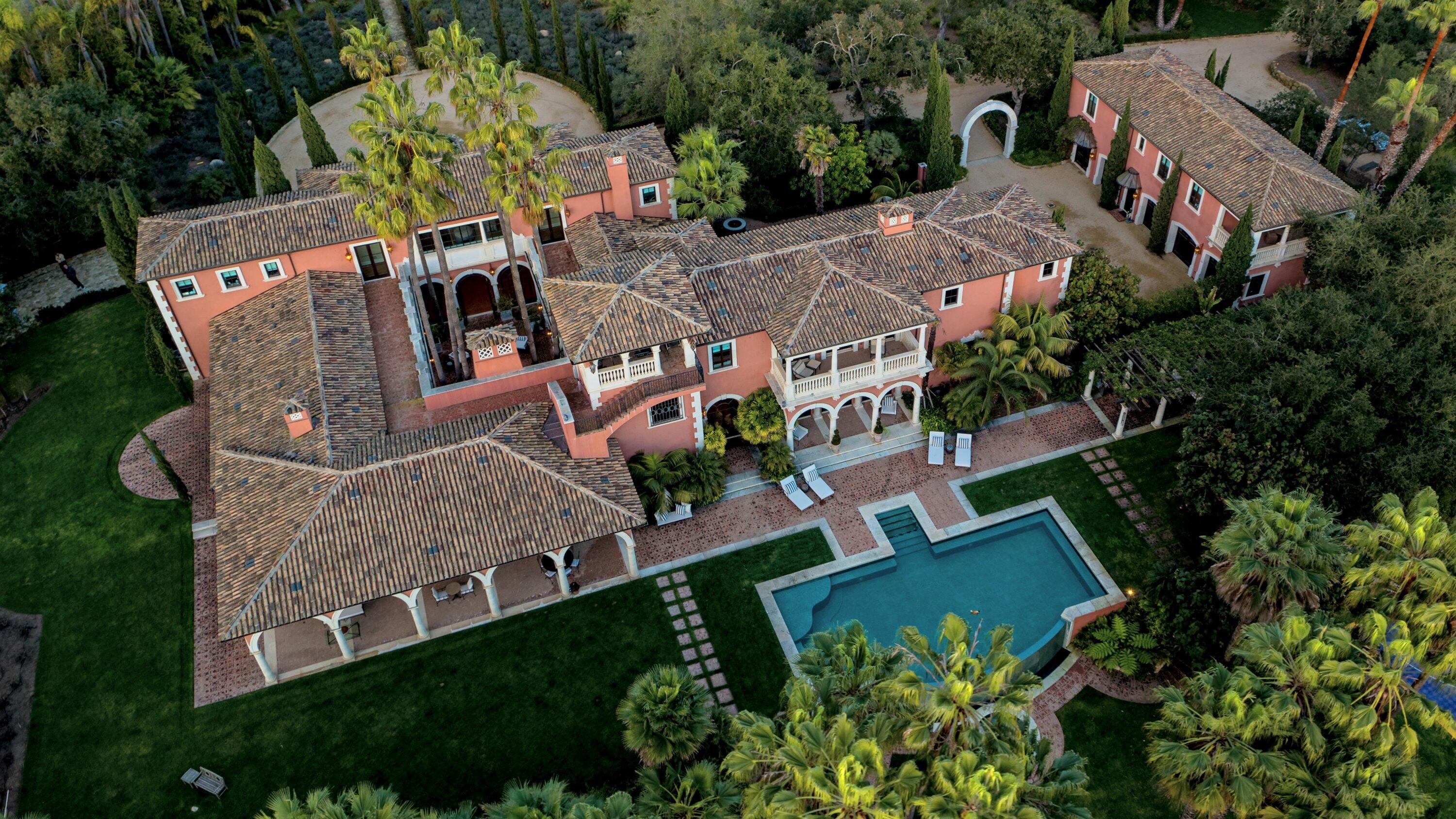 an aerial view of a house with a garden