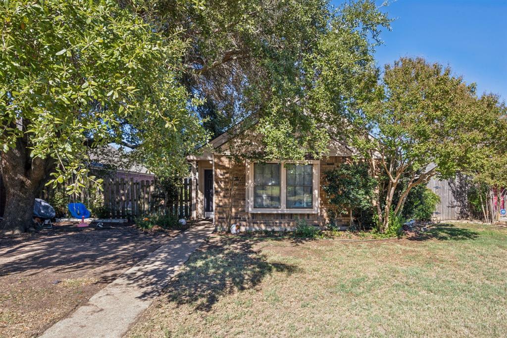 a view of a house with a tree