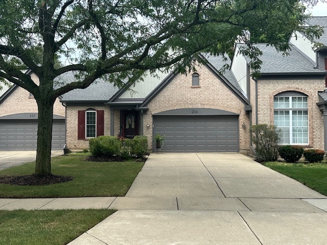 a front view of a house with yard