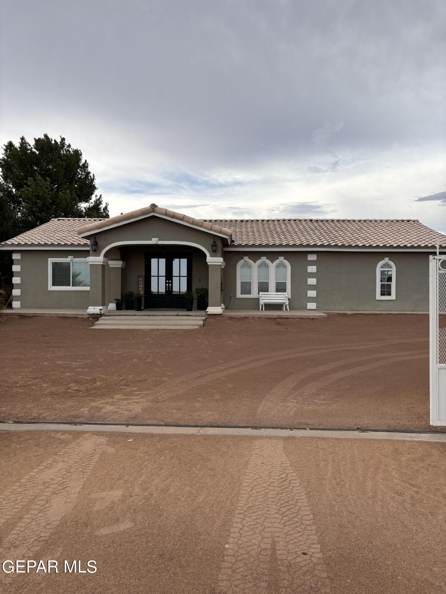 a front view of a house with a garage