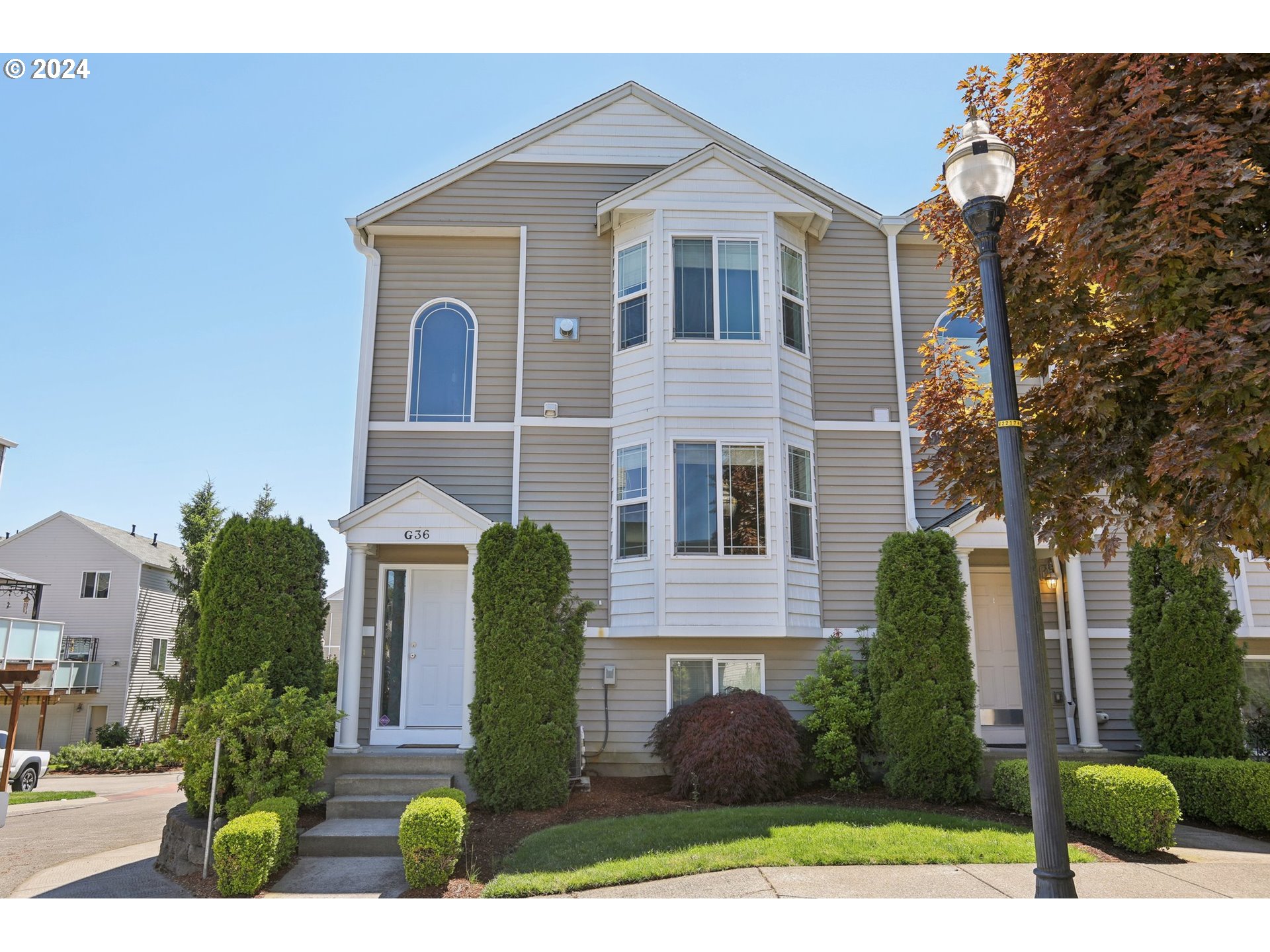 a front view of a house with a yard