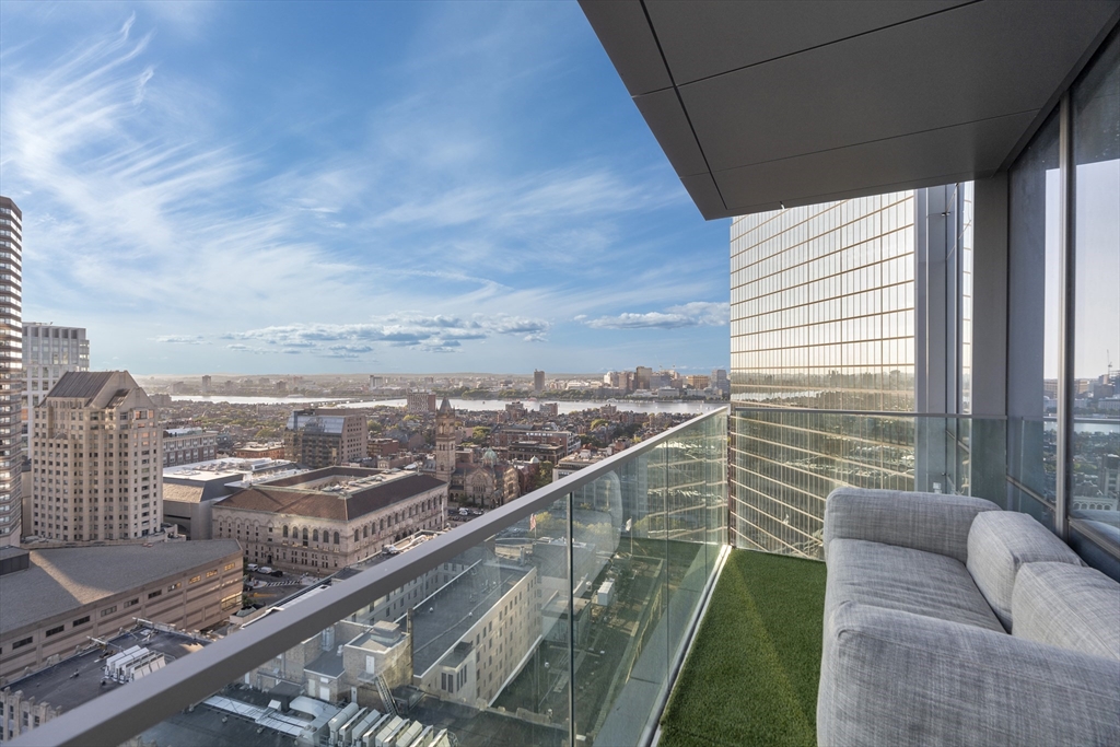 a view of a balcony with city