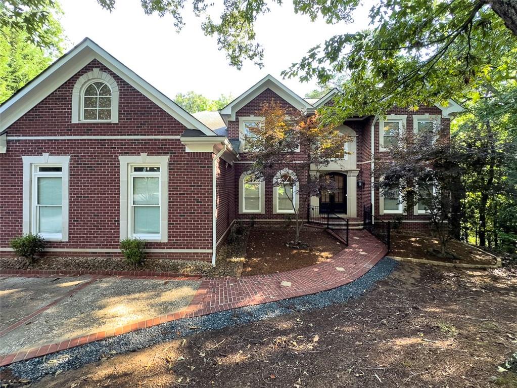 a front view of a house with yard