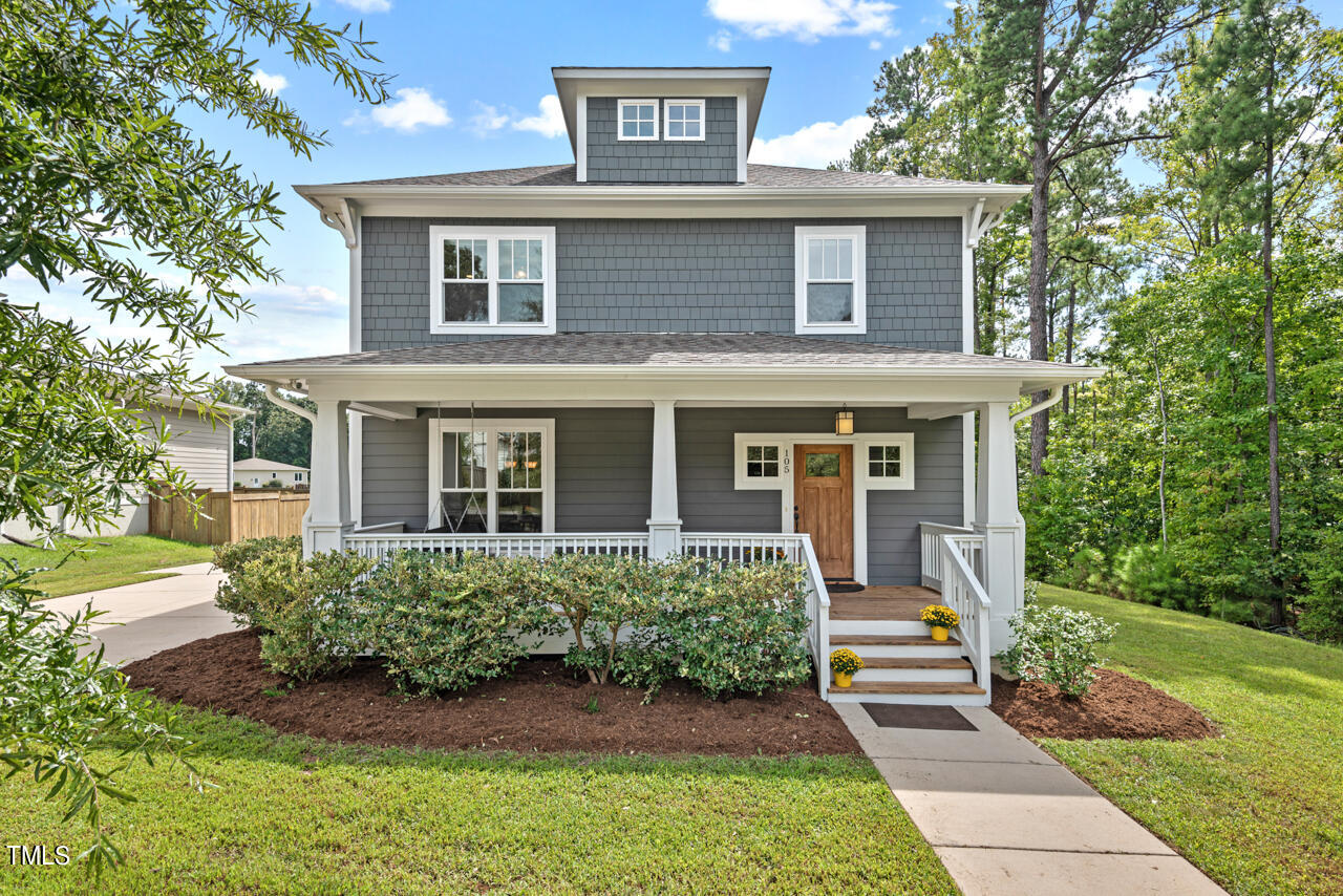 front view of a house with a yard