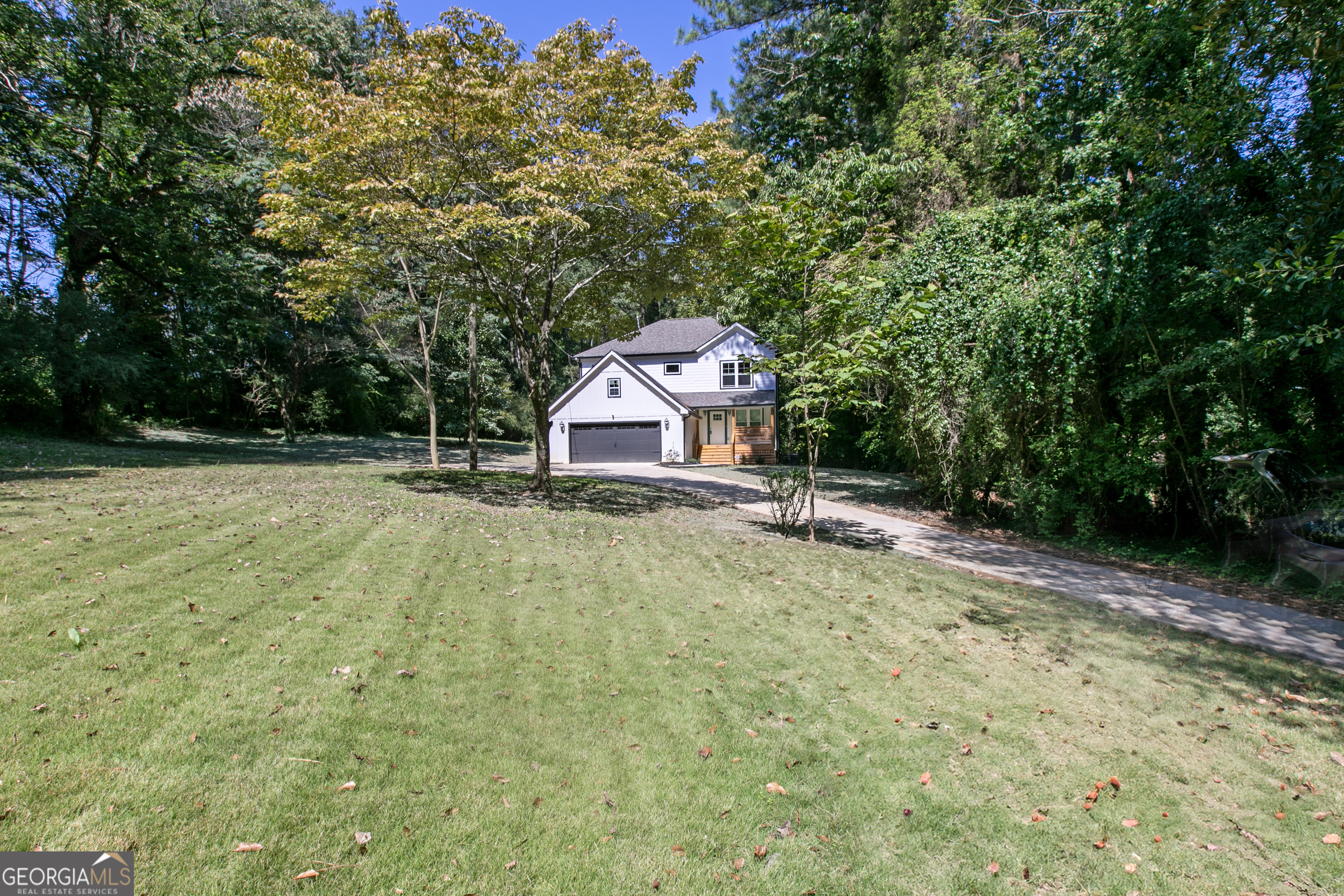 a house with trees in the background