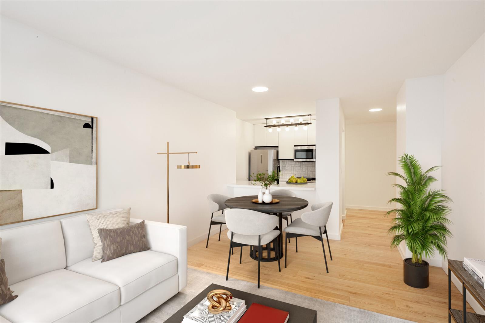 a living room with furniture and a potted plant