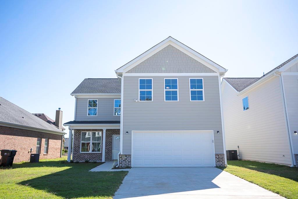 a front view of a house with a yard