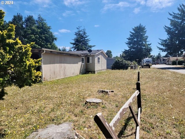 a view of a backyard that has a tree