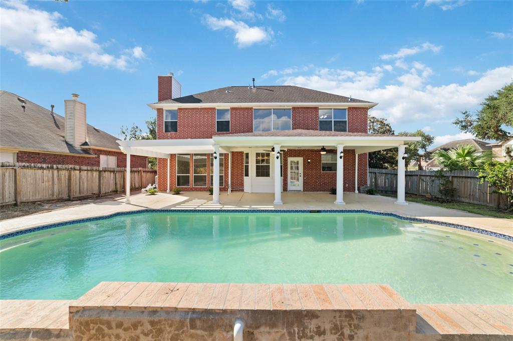 a view of a house with a swimming pool