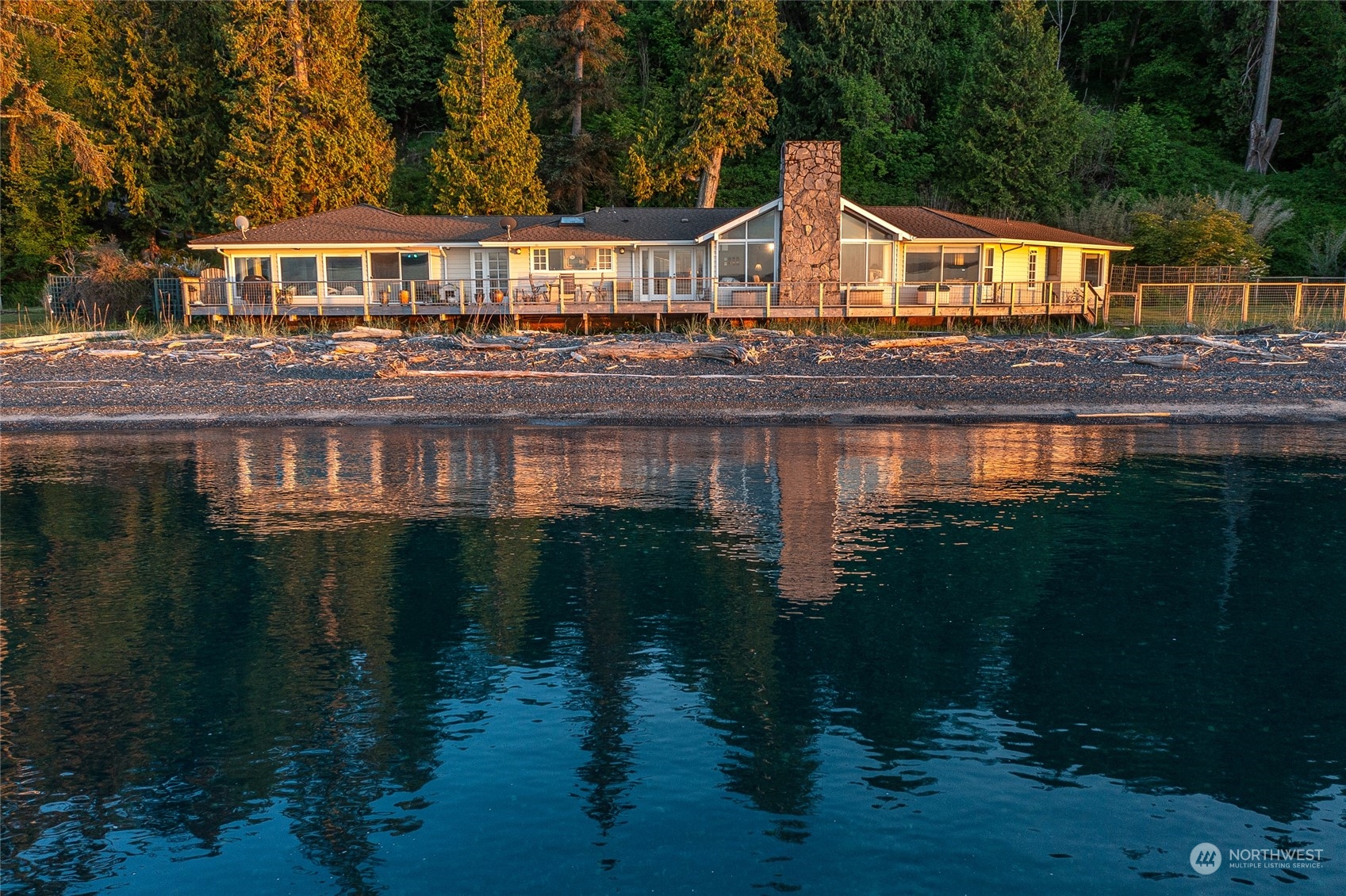 a front view of a house with a lake view