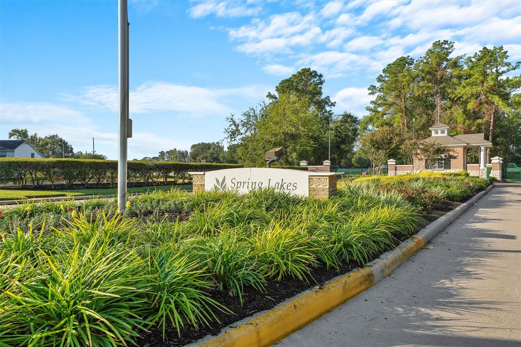 Welcoming entrance to the serene Spring Lakes community