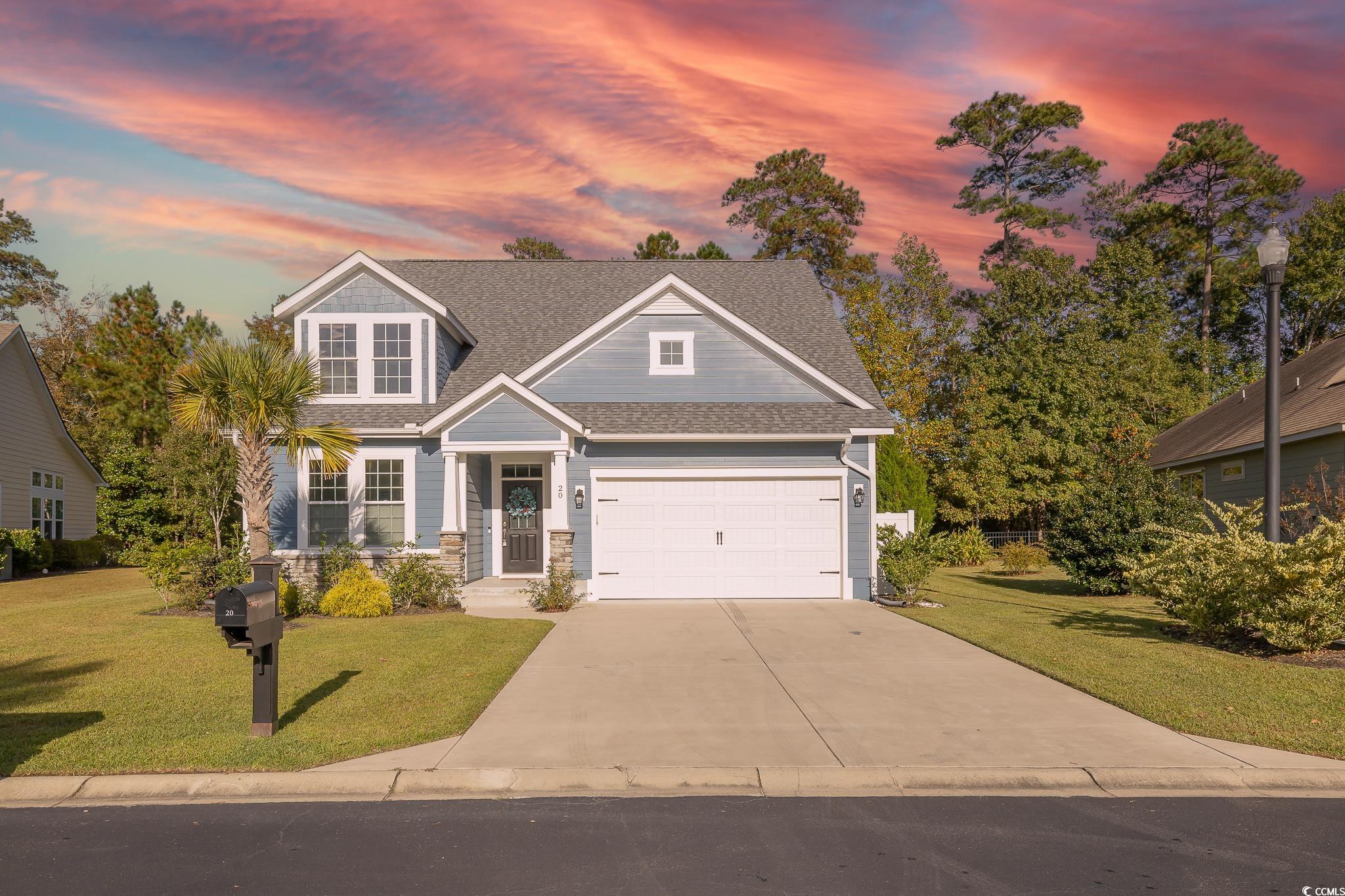 Craftsman-style home with a yard