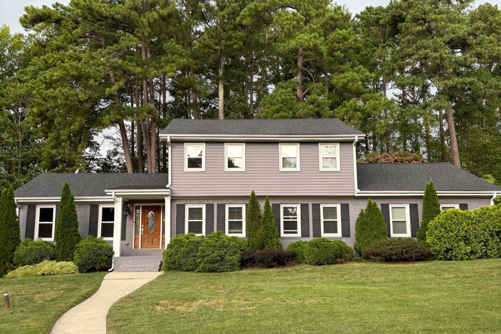 a front view of a house with a yard