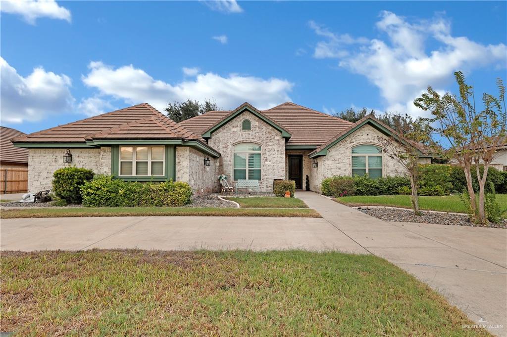 View of front of property with a front lawn