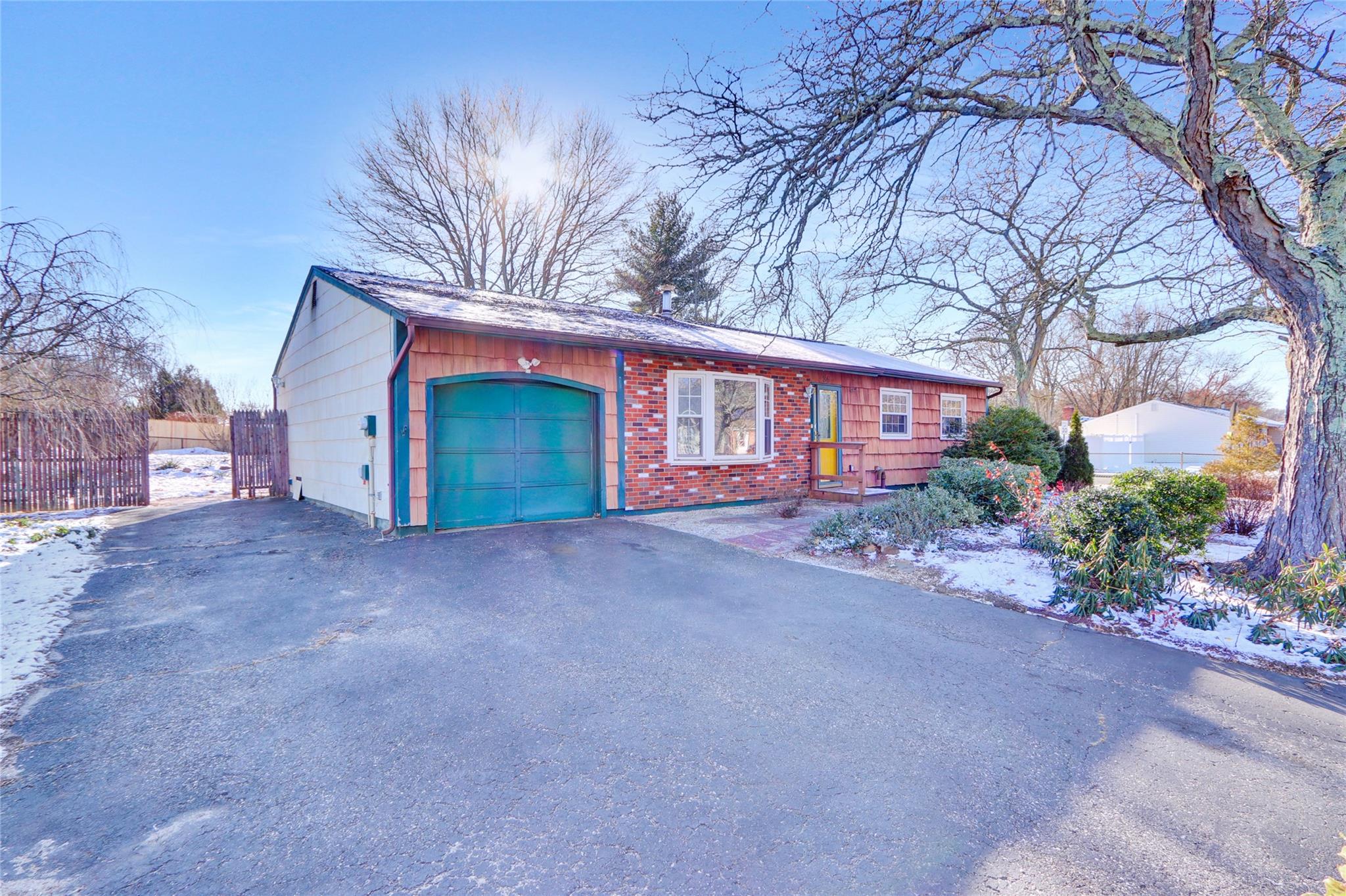 a view of a house with a yard and garage