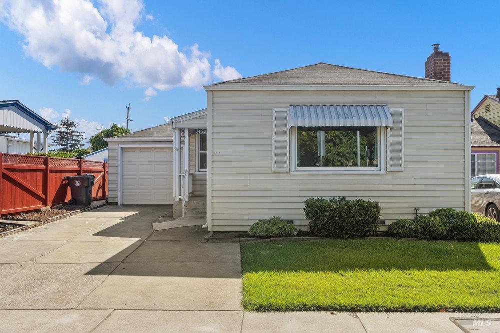 a front view of a house with garage