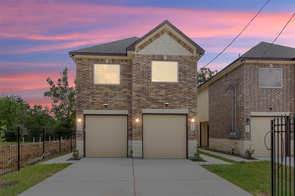 a front view of a house with a garage