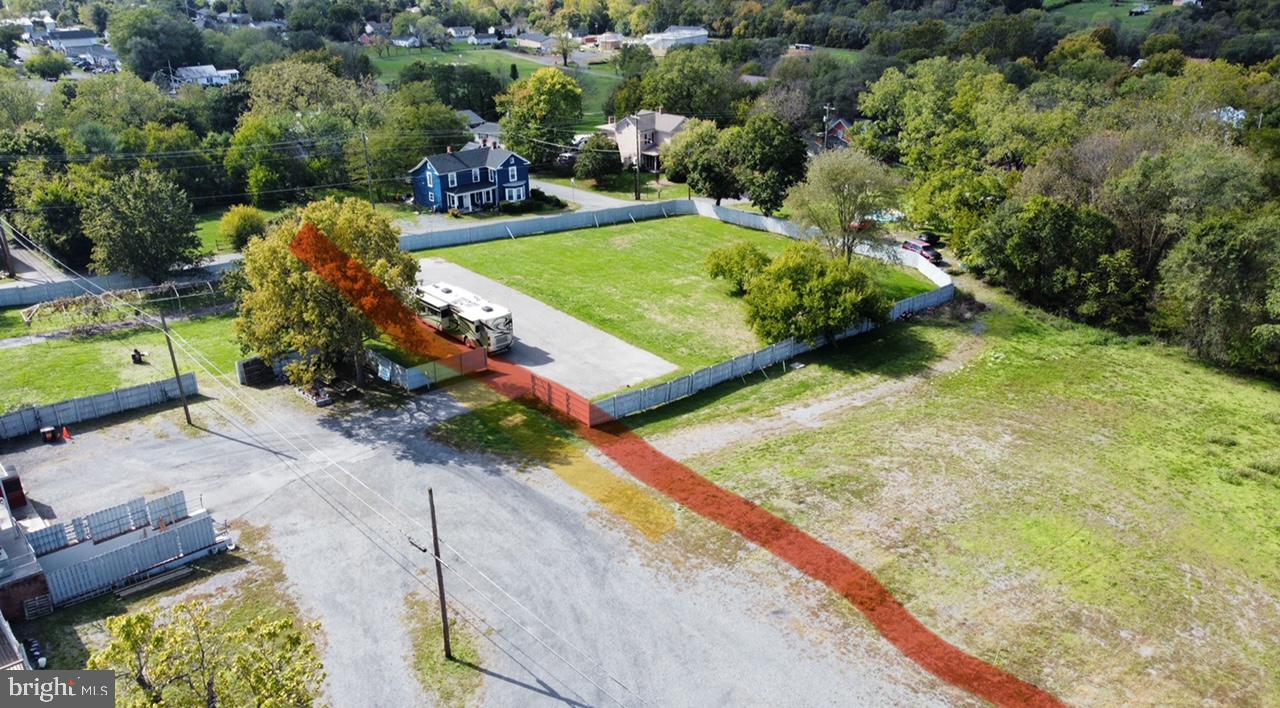 an aerial view of a backyard with swimming pool