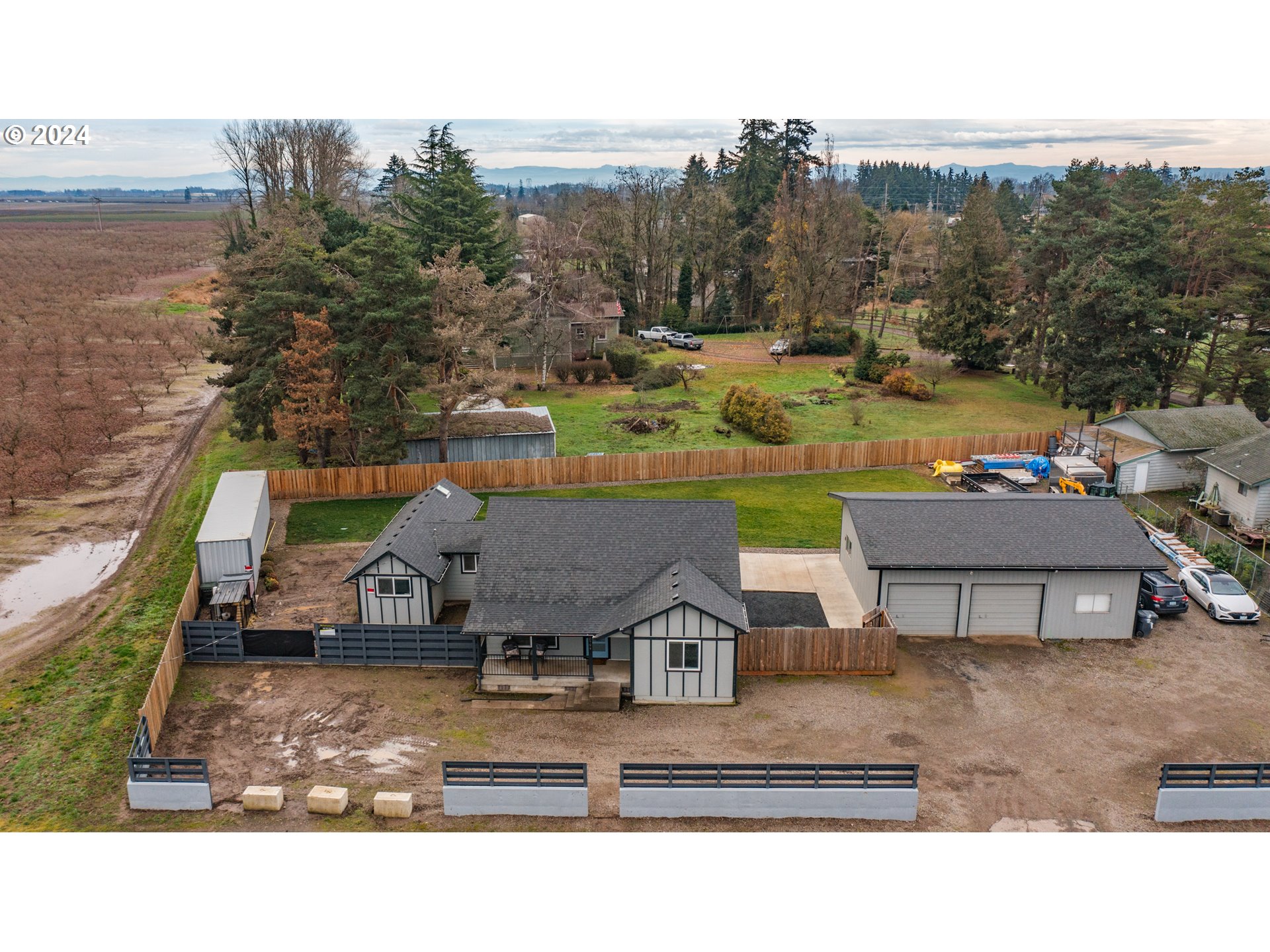 a view of a house with pool and a yard