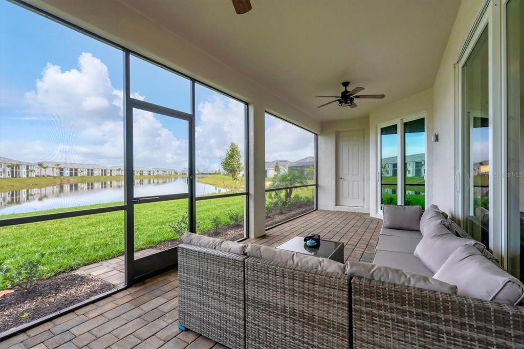 a living room with couch next to a large window