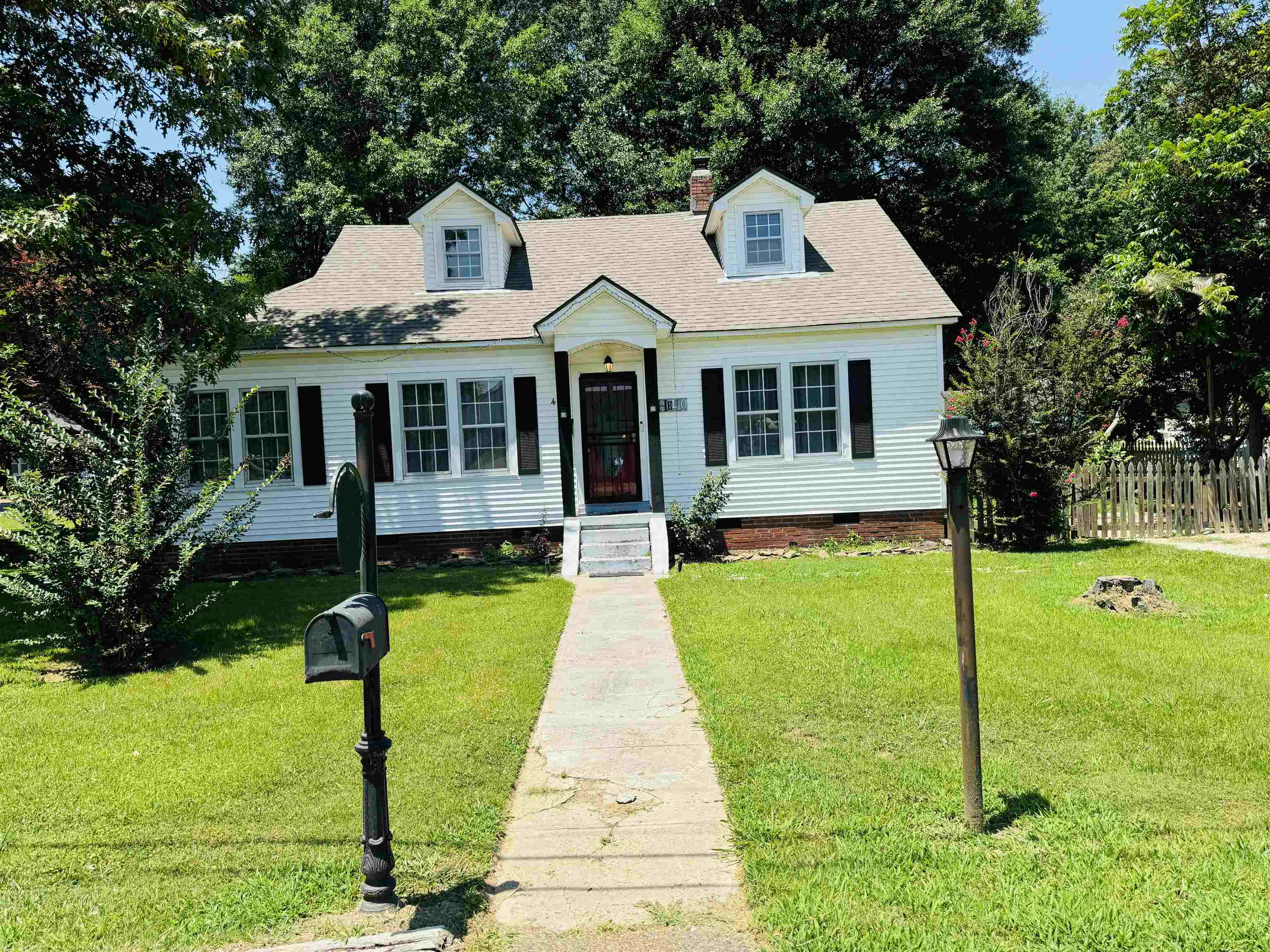 a front view of a house with yard